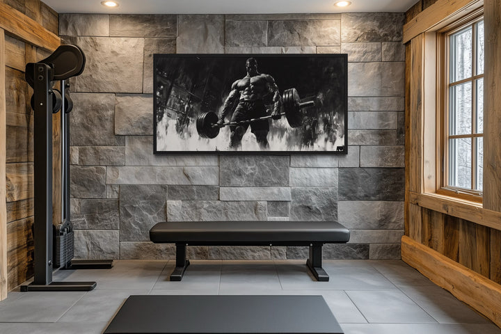 Man doing deadlift motivational black and white framed canvas wall art in a modern home gym.