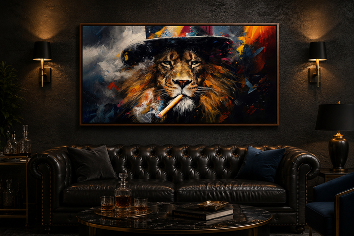 Framed canvas print of a lion smoking a cigar above a black leather sofa in a dark lounge.