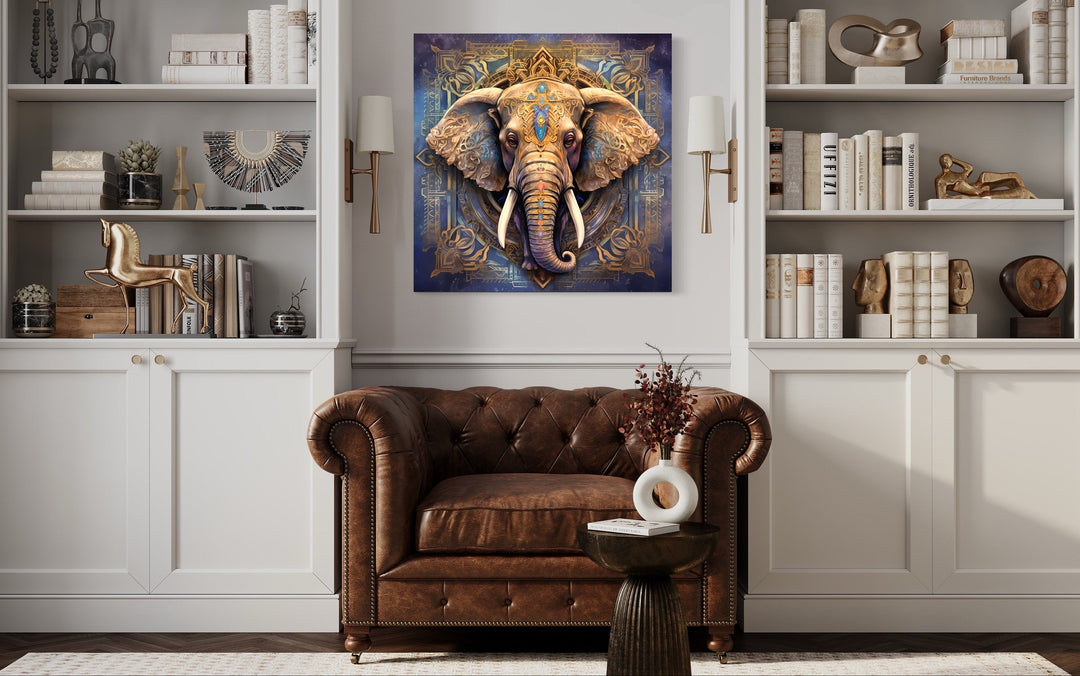 Mandala Elephant Indian Framed Canvas Wall Art hanging above a brown leather armchair.