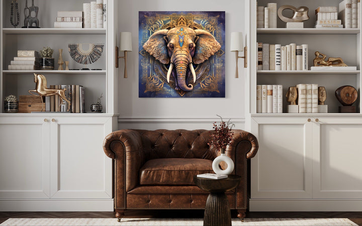 Mandala Elephant Indian Framed Canvas Wall Art hanging above a brown leather armchair.