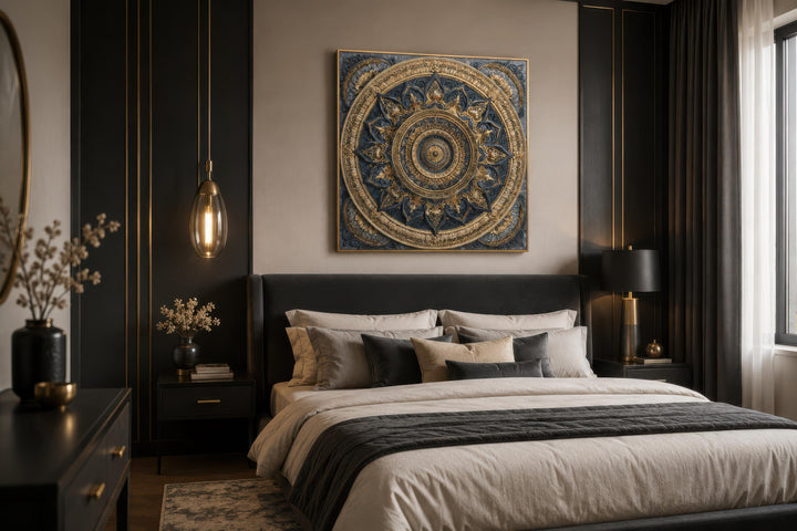 Intricate blue and gold mandala canvas art centered above a modern bed in a dark, elegant bedroom.