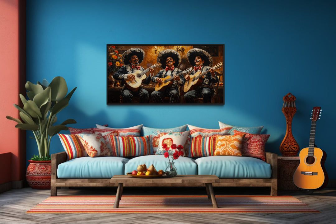 Extra large framed canvas print of a mariachi band performing on a blue wall above a sofa.