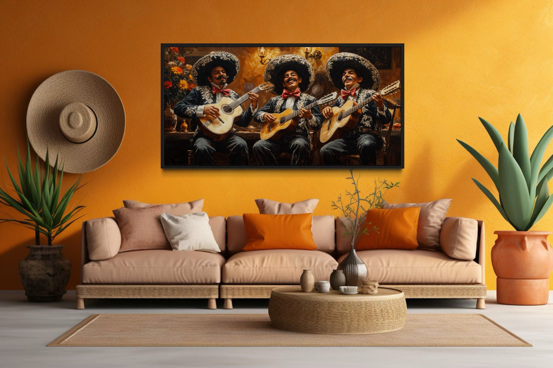 Framed extra large canvas print of a mariachi band on an orange wall above a tan sofa.