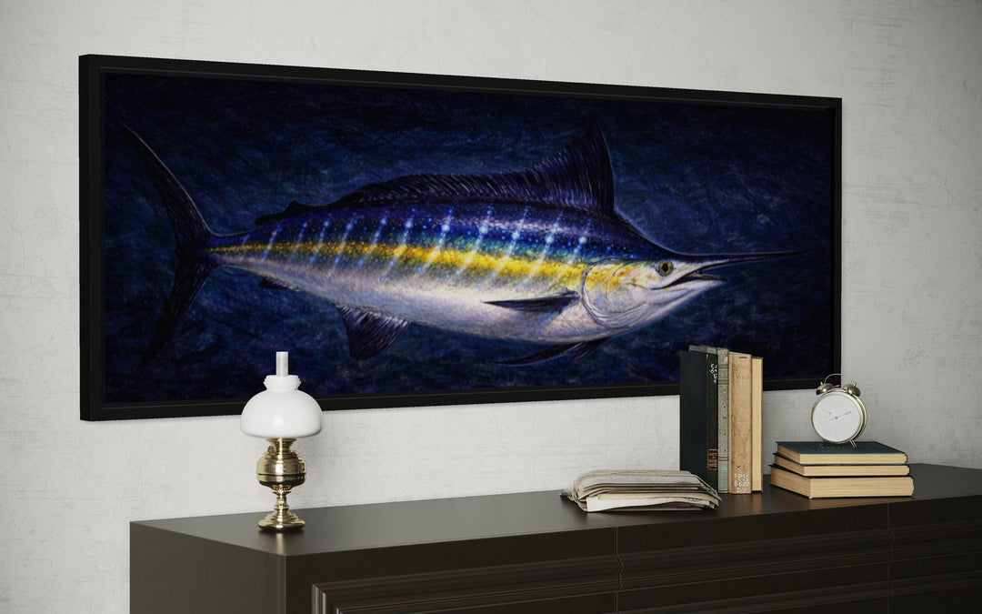 A long horizontal canvas print of a blue marlin swimming in a dark, rippling ocean.