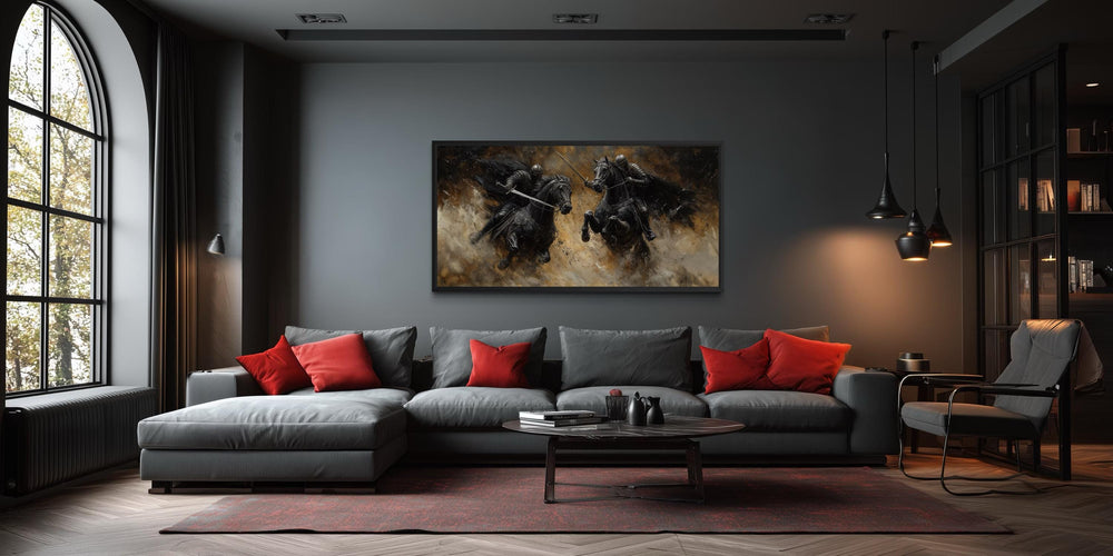 Horizontal framed canvas painting of two medieval knights dueling on horseback in a dark room.