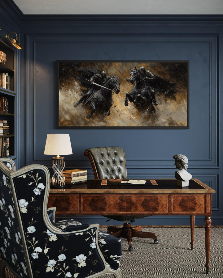 Horizontal framed canvas painting of two medieval knights in a dramatic duel on horseback.