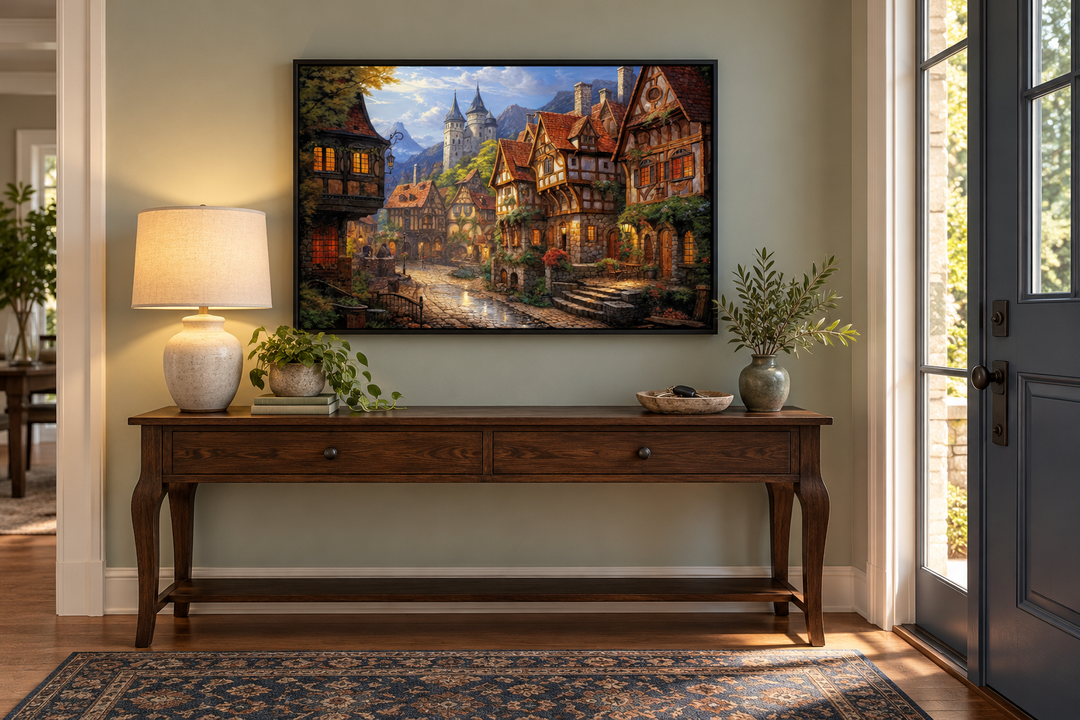 Medieval European whimsical village framed canvas wall art hanging above a wooden console table.
