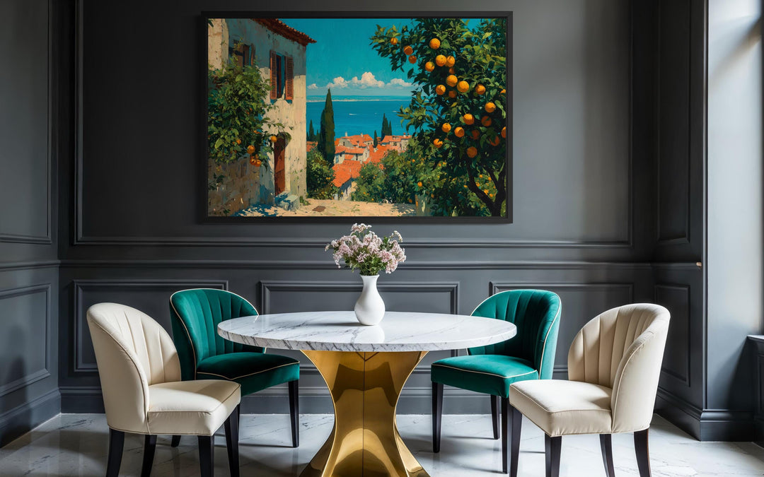 Mediterranean village canvas wall art with orange trees above a marble dining table.