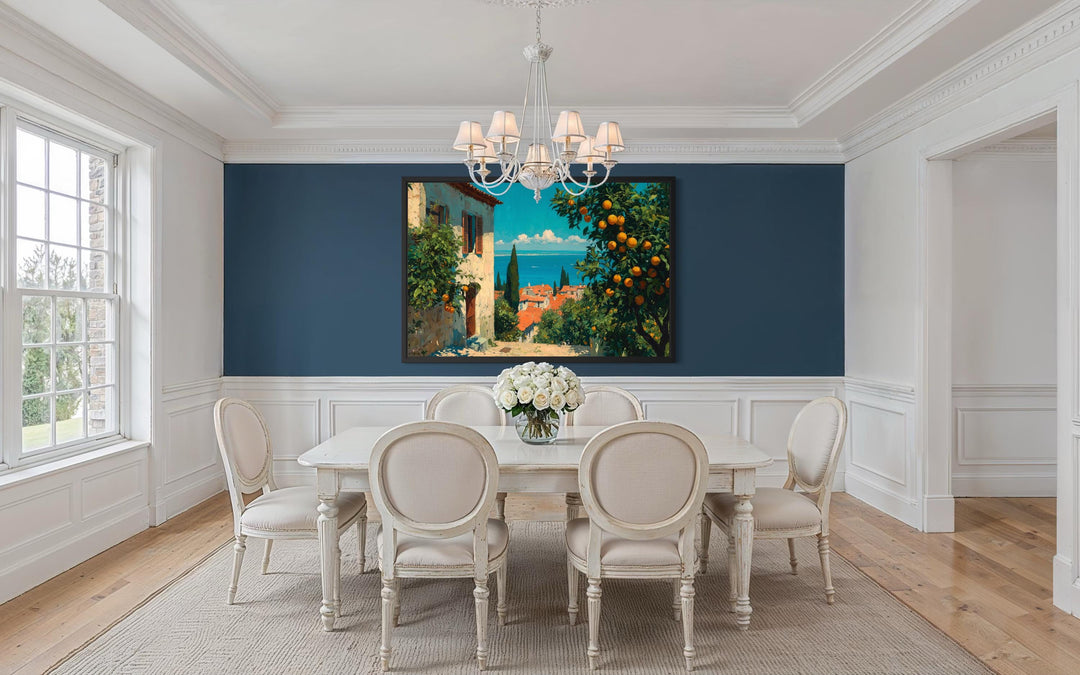 Mediterranean village canvas wall art with orange trees displayed in a classic blue dining room.