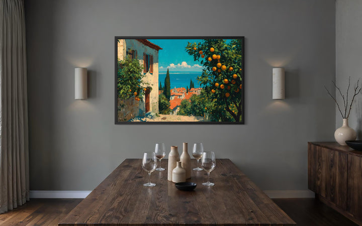 Mediterranean village canvas wall art with orange trees hanging in a modern dining room.