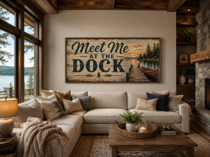 Rustic Meet Me at the Dock canvas wall art hanging above a sofa in a lake house living room.