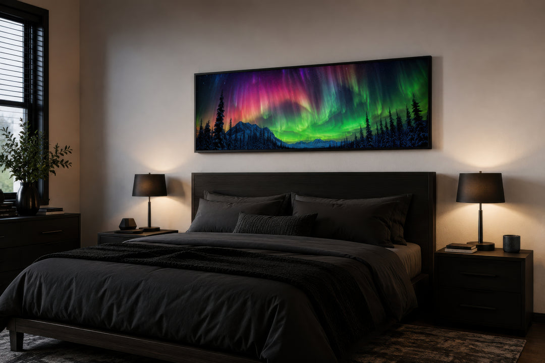 Aurora Borealis long horizontal framed canvas wall art hanging above a dark modern bed.