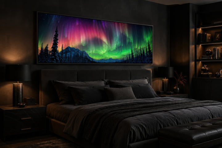 Aurora Borealis long horizontal framed canvas wall art above a bed in a dark, modern bedroom.