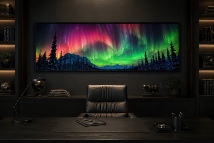 Aurora Borealis long horizontal framed canvas wall art above a desk in a dark office setting.