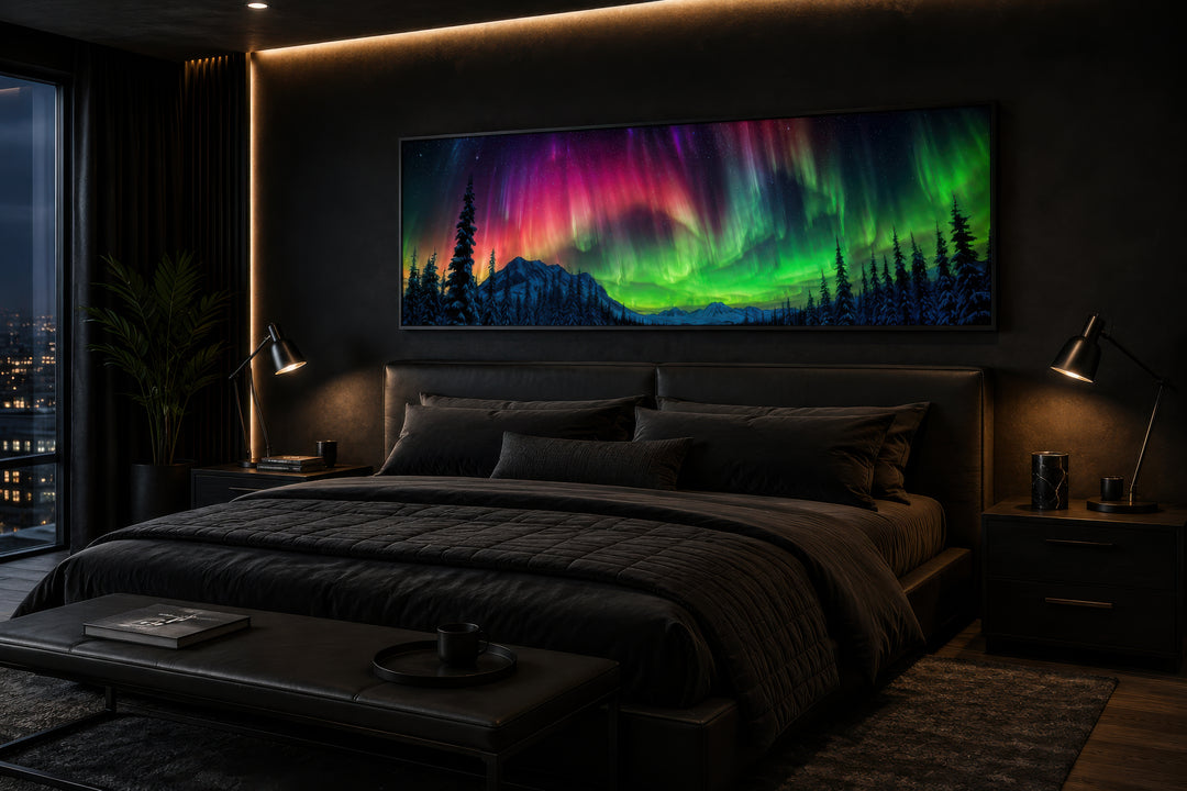 Horizontal framed canvas of the Aurora Borealis above a bed in a dark, modern bedroom.