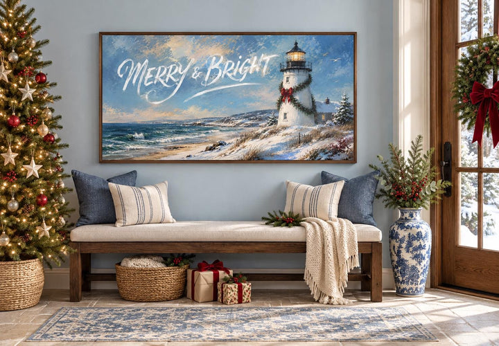 Merry & Bright coastal Christmas lighthouse framed canvas wall art above a bench with pillows.