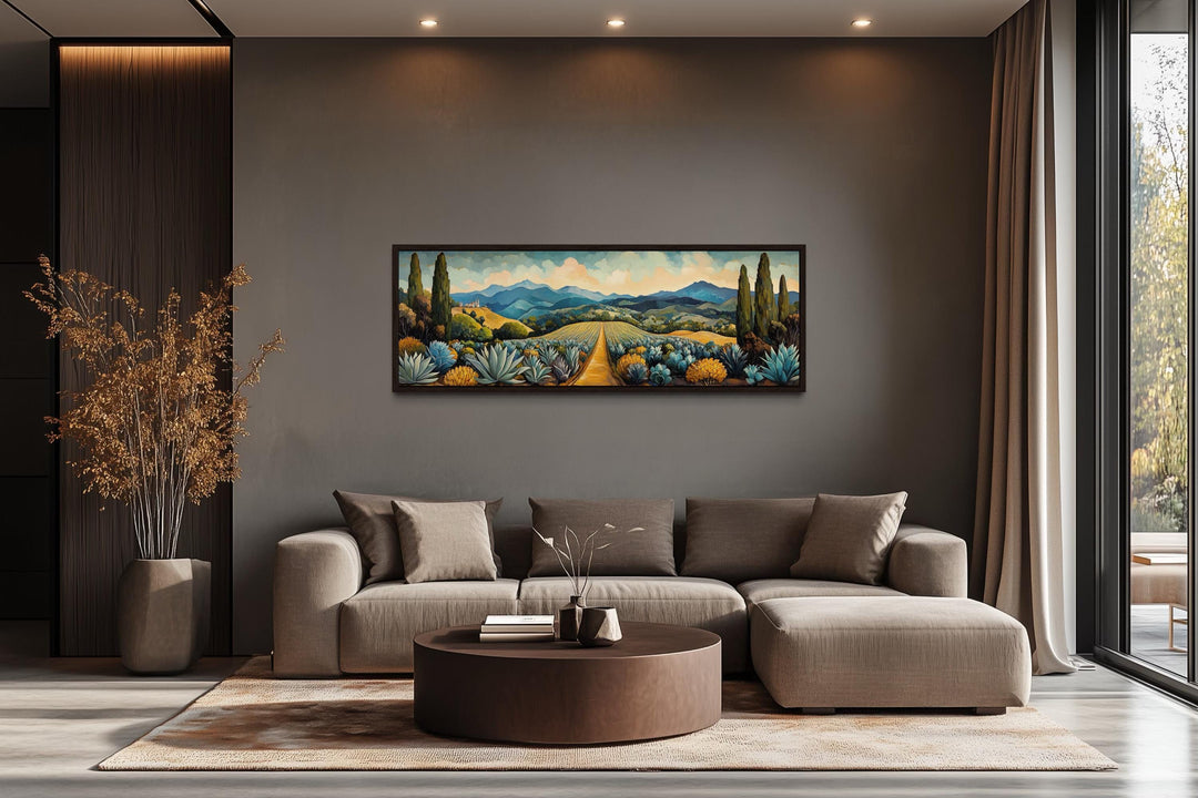 Mexican Agave Field Panoramic Canvas Wall Art displayed above a modern sofa in a living room.