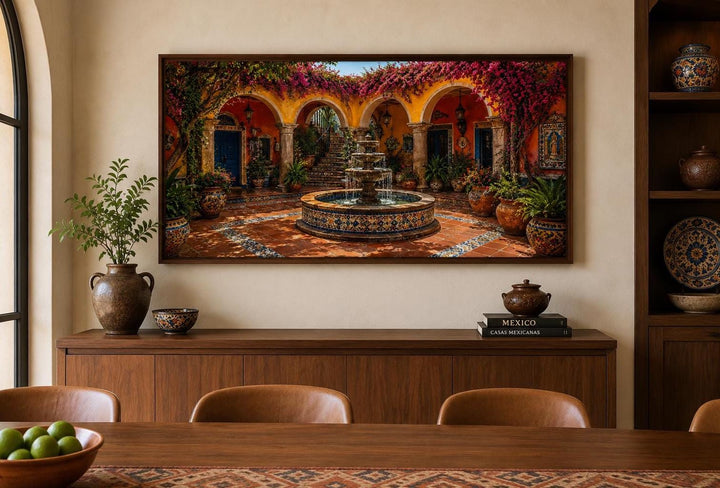 Mexican Courtyard Fountain canvas wall decor in a wood frame above a dining room buffet.
