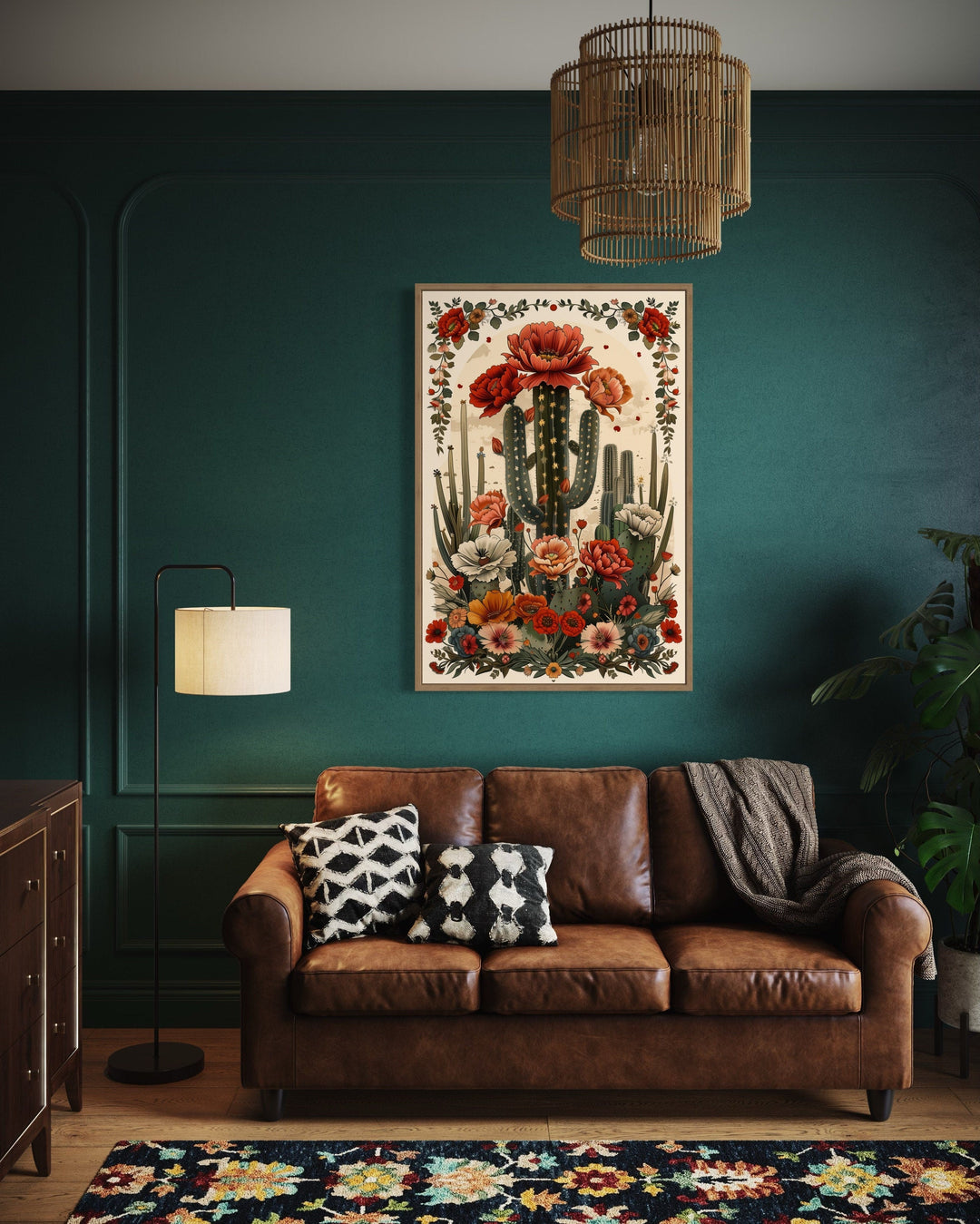 Mexican Vertical Cactus In Bloom Framed Canvas Wall Art hanging above a brown leather sofa.