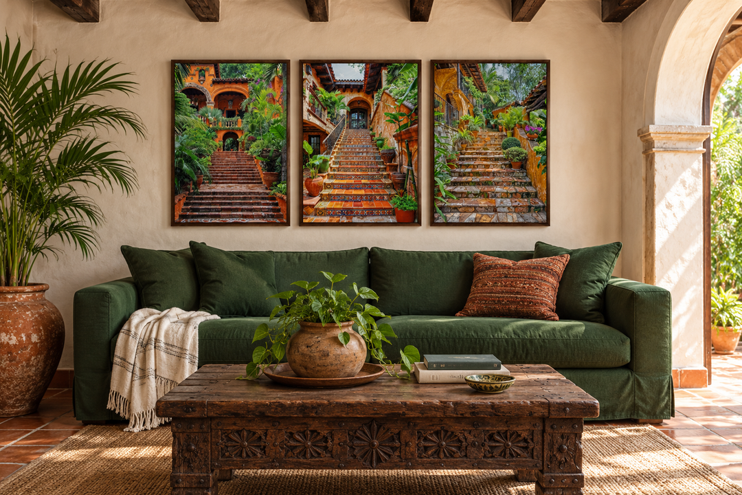 Triptych of framed canvas wall art featuring colonial Mexican hacienda stairs above a green sofa.