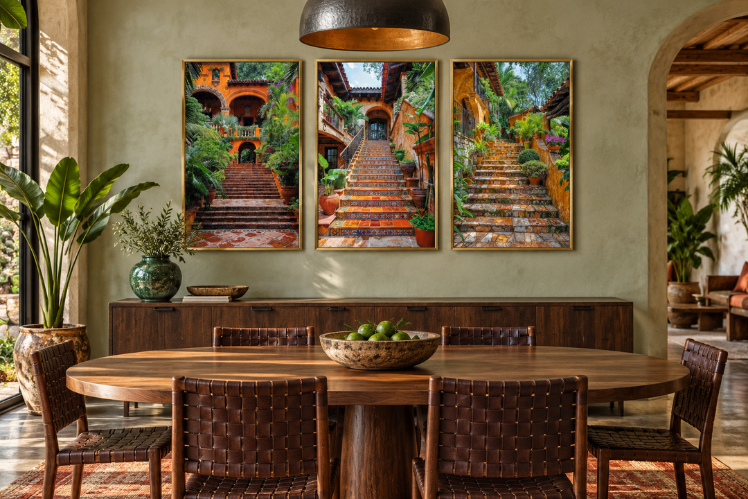 Trio of framed canvas prints showing colonial Mexican hacienda stairs with lush plants in a dining room.