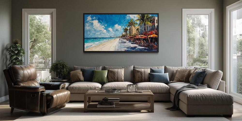 A colorful Miami Beach cityscape canvas print hangs above a neutral sectional sofa in a living room.