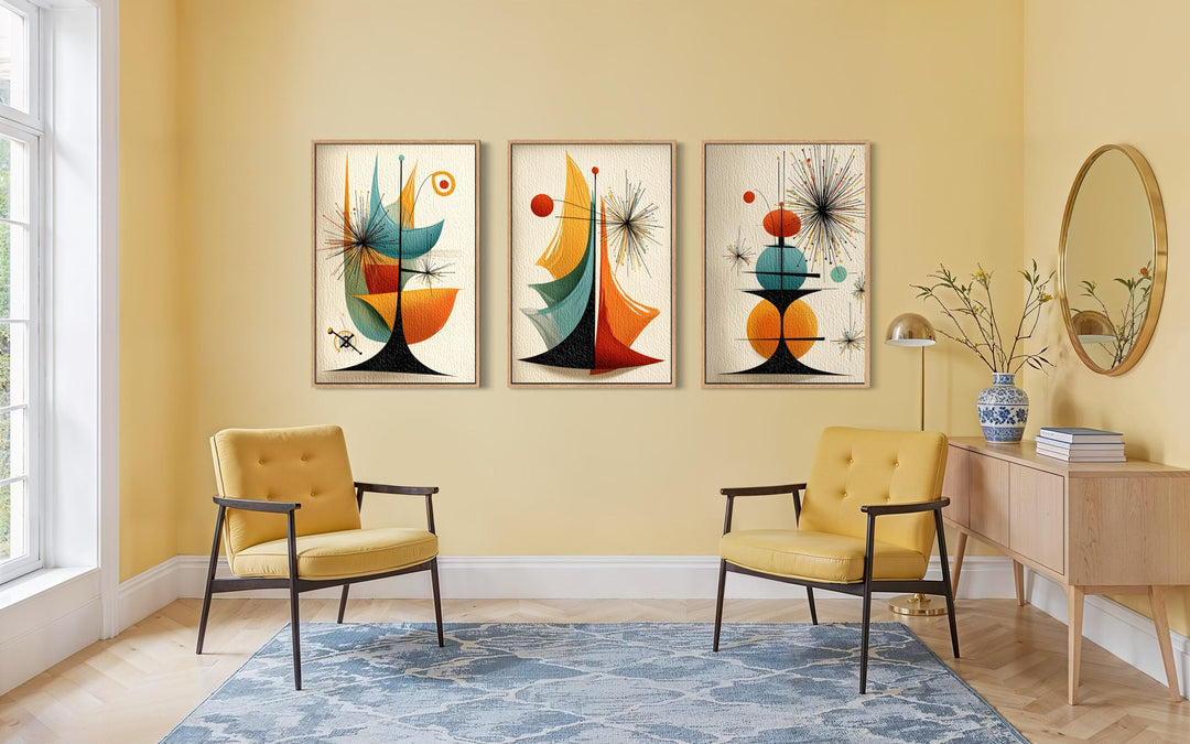 Set of three mid-century modern abstract prints with retro geometric shapes in a yellow living room.