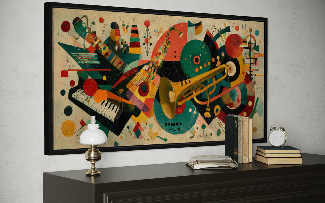 Mid century modern abstract jazz instruments canvas print in a black frame above a dark wood dresser.
