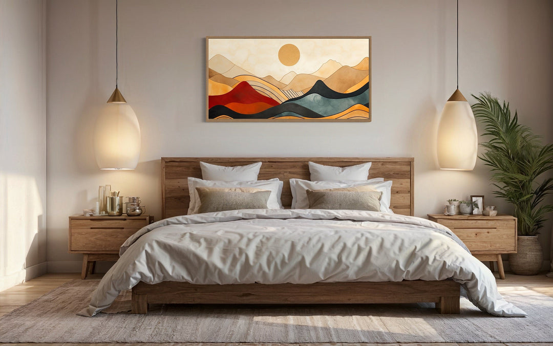 Extra large mid century modern mountain canvas wall art hanging above a wooden bed frame.