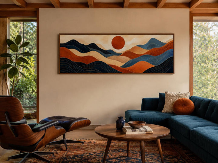 Mid century modern long horizontal abstract wall art with orange and navy blue mountain landscape.