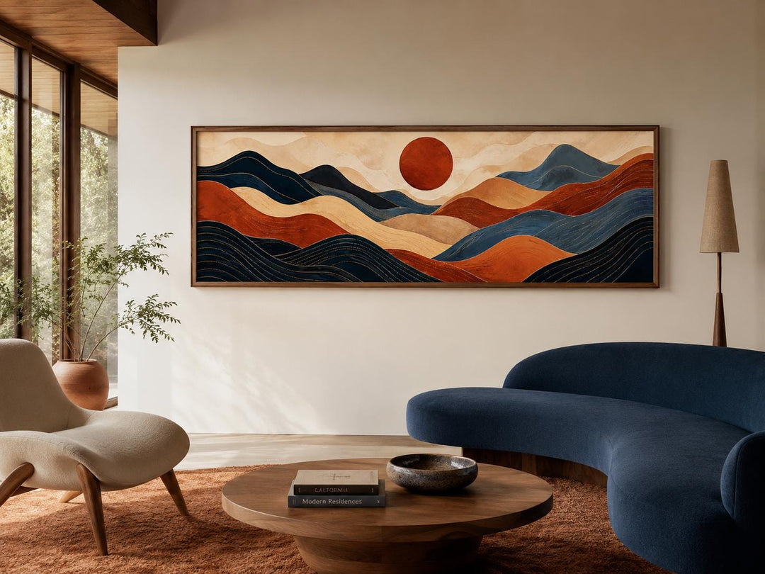Horizontal abstract mountain wall art with burnt orange and navy blue ridges under a red sun.