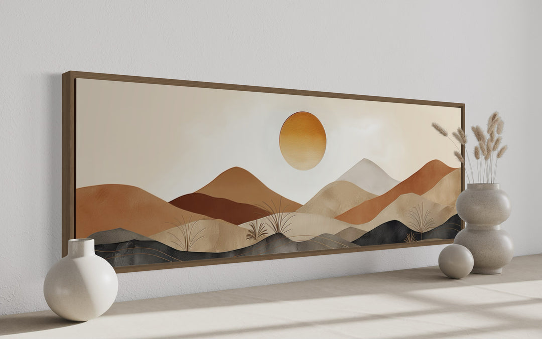 Mid century modern long narrow canvas art featuring a neutral brown and beige mountain sunset.