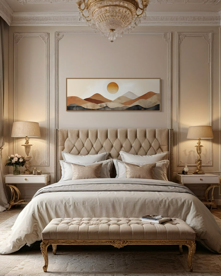 Mid century modern neutral mountain sunset landscape canvas wall art above a tufted bed.
