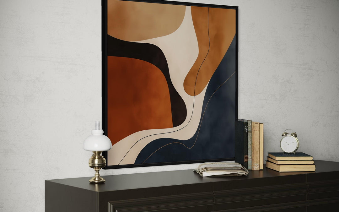 Mid Century Modern abstract square canvas wall art with organic shapes in navy and earth tones.