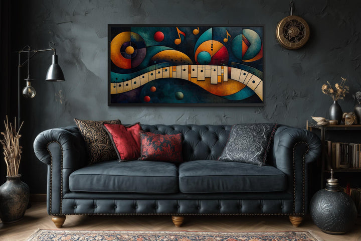 Mid Century Modern abstract piano canvas print with colorful geometric shapes over a dark sofa.