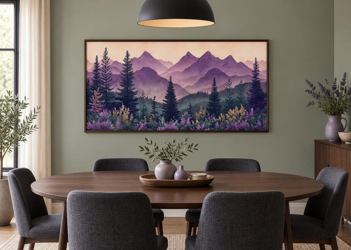 Mid century modern purple and green mountain landscape framed canvas art in a dining room.