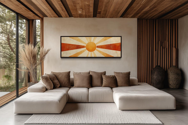 Mid-century modern sun rays long horizontal wall art in a minimalist living room above a sofa.