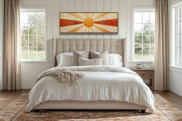 Mid Century Modern Sun Rays long horizontal wall art in a bedroom above a beige tufted headboard.