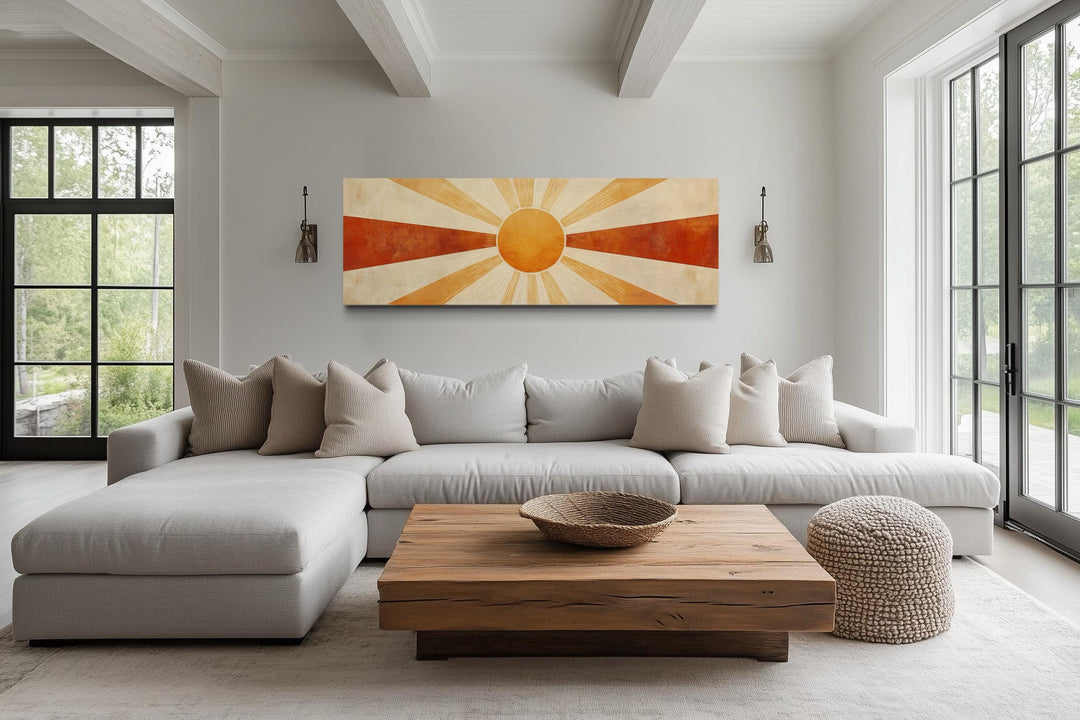 Mid century modern sun rays long horizontal wall art in a neutral living room above a sofa.