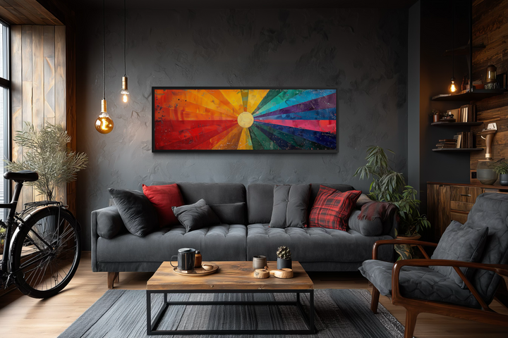 Mid Century Modern Sun Rays Panoramic Canvas Wall Art displayed above a dark gray sofa.