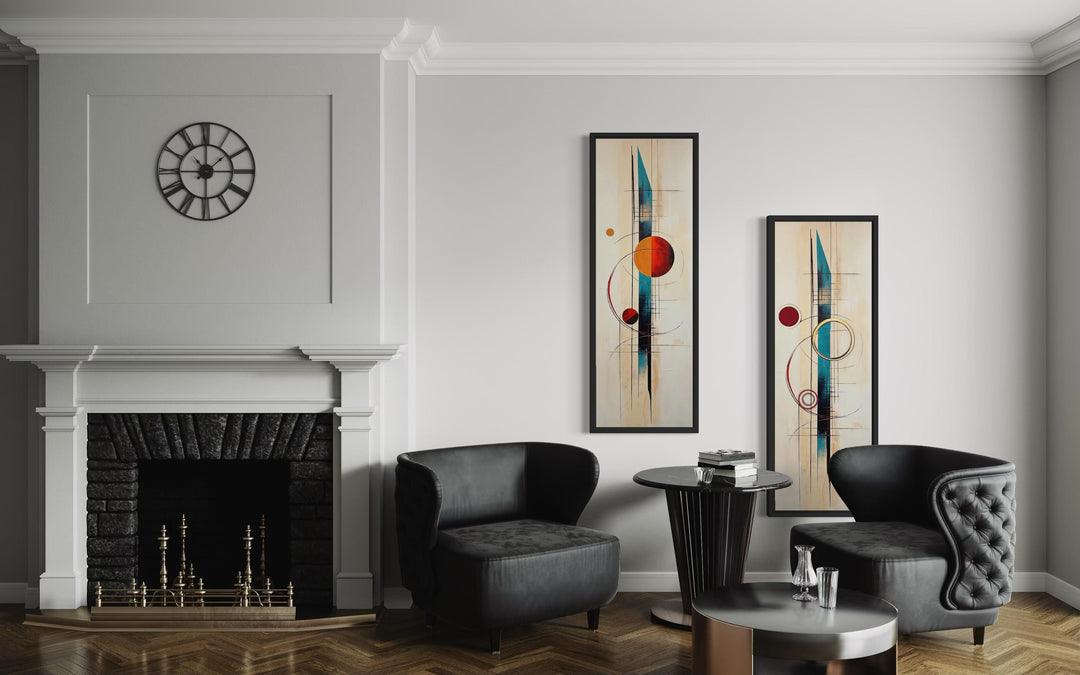 Set of two tall, narrow mid-century modern canvas prints with geometric shapes in a living room.