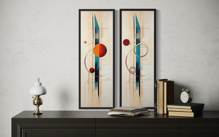 Set of 2 tall narrow canvas prints with mid-century modern geometric shapes in teal, red, and gold.
