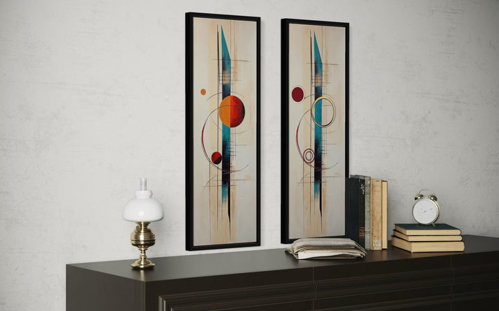 Set of two tall, narrow mid-century modern canvas prints with geometric shapes in teal and orange.