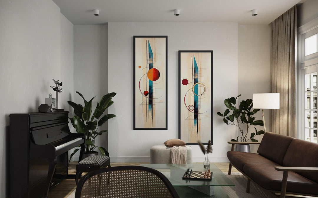 Two tall, narrow mid-century modern canvas prints with geometric shapes in a stylish living room.