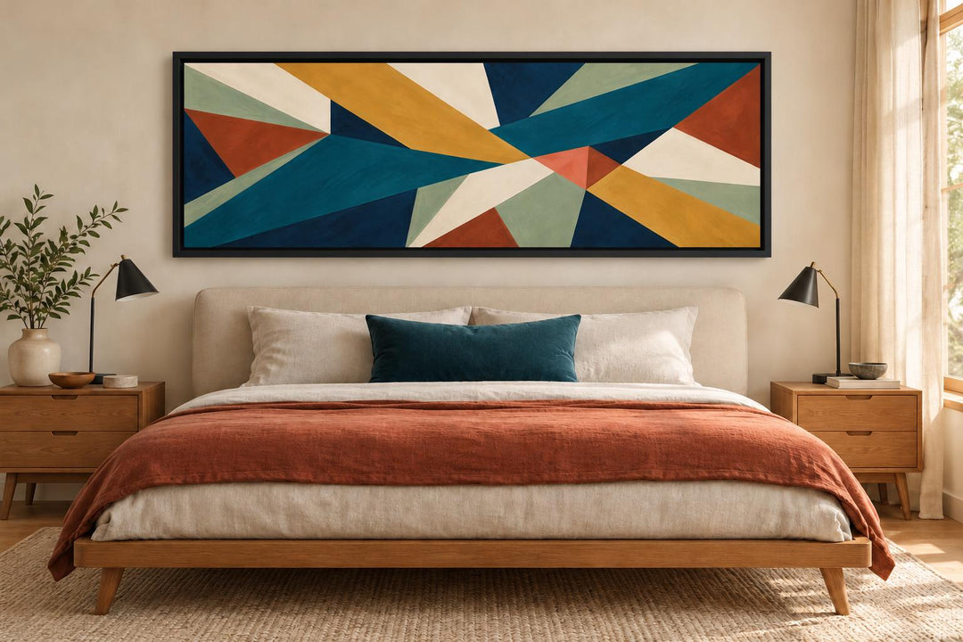 Mid Century Modern teal and ochre geometric abstract long horizontal canvas art above a bed.