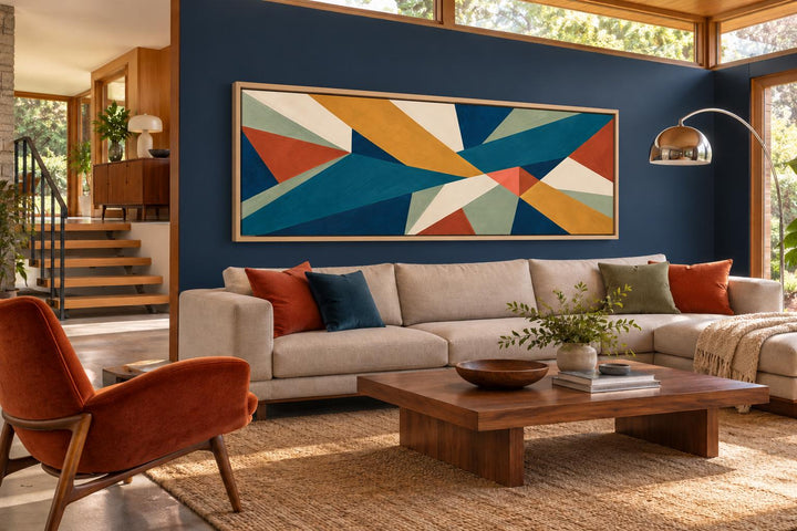 Mid-century modern long horizontal canvas wall art with teal and ochre geometric abstract shapes.