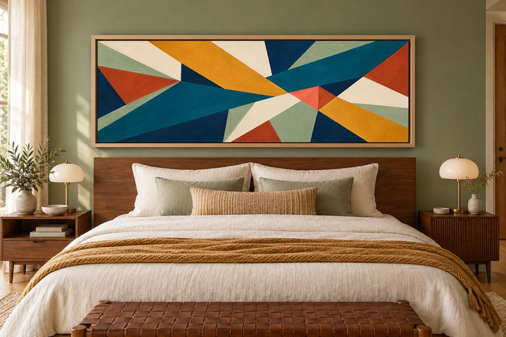 Mid Century Modern teal and ochre geometric abstract long horizontal canvas art above a bed.
