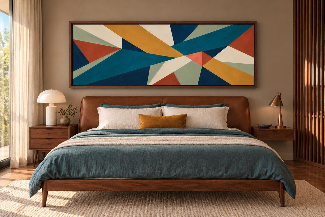 Mid Century Modern teal and ochre geometric abstract long horizontal canvas art above a bed.