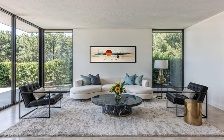 Long horizontal mid-century modern abstract canvas print with geometric shapes above a white sofa.