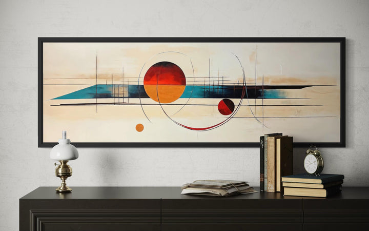 Mid-century modern abstract canvas print with geometric shapes in a long horizontal black frame.
